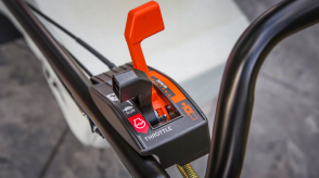 Closeup of the controls on the handlebar of a Honda mower.  