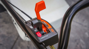 Closeup of the controls on the handlebar of a Honda mower.  