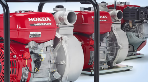 Three Honda pumps are displayed side-by-side in a nondescript environment. 